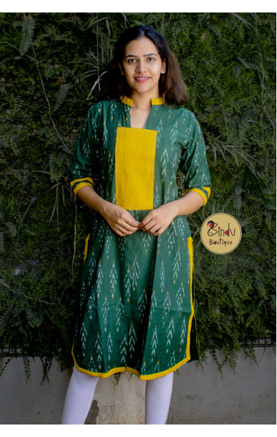 Green ikkat dress with yellow patch below neck