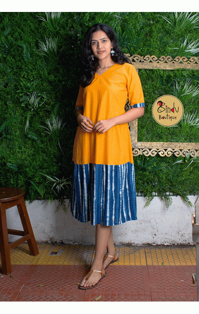 Yellow coloured dress with indigo freel