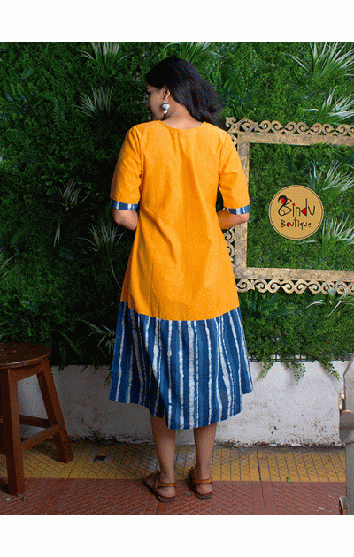 Yellow coloured dress with indigo freel