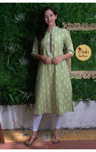 Pista green coloured kurti with black colored lace