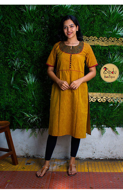 Yellow colored kurti with green patch